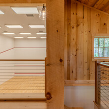 loft overlooking an indoor squash court
